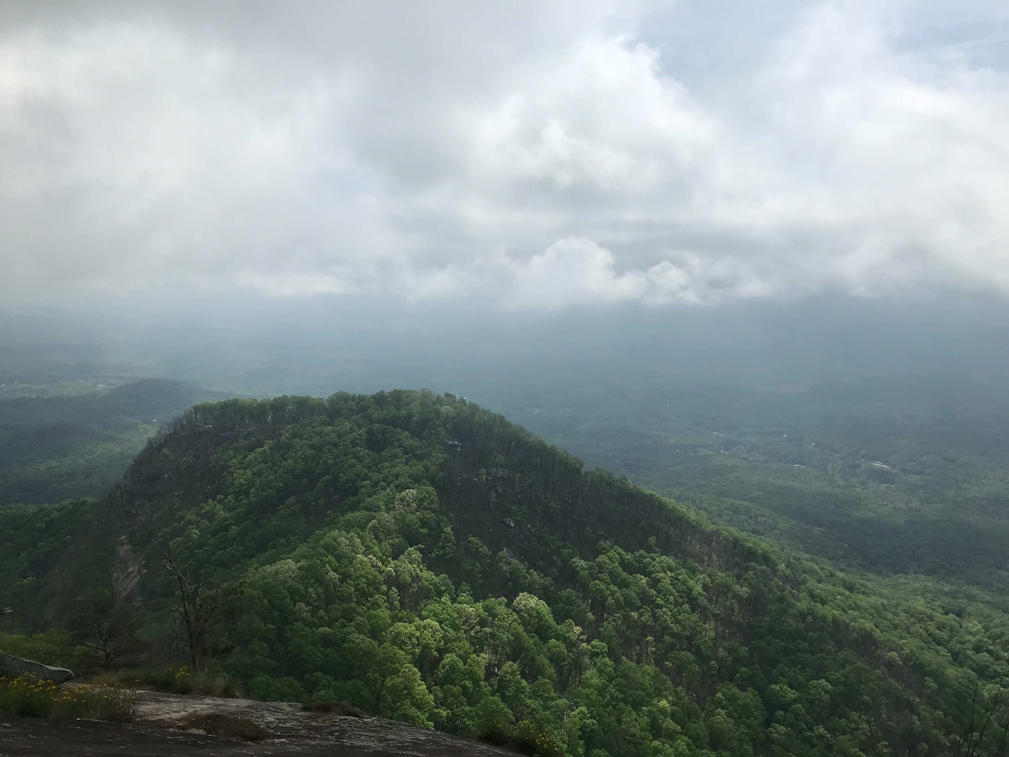 Decorative Image-Top of a mountain with storm clouds in the background